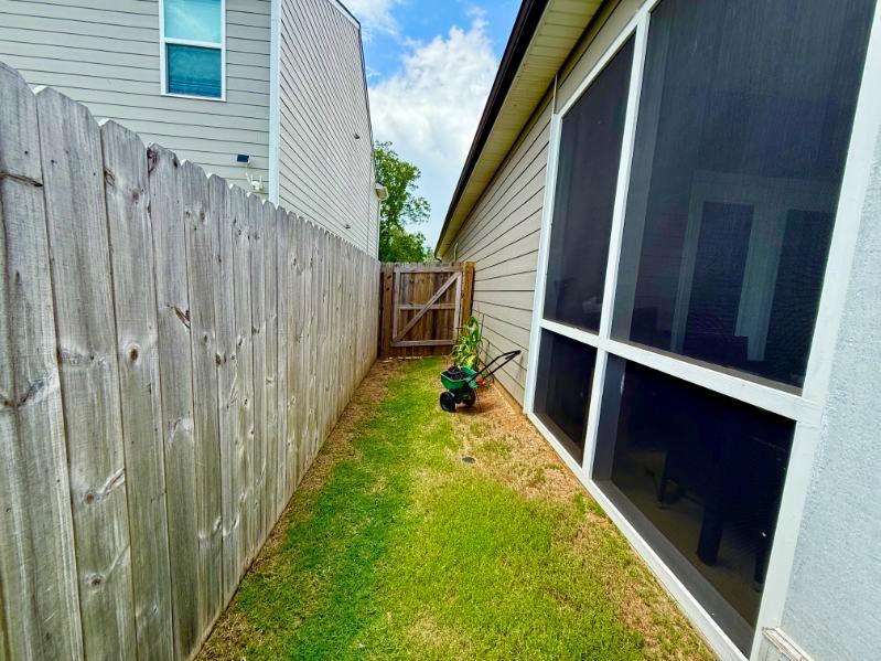 2015 Waycross Lane Dacula, GA 30019 - Photo 44 of 49 a view of a backyard with wooden fence and a staircase