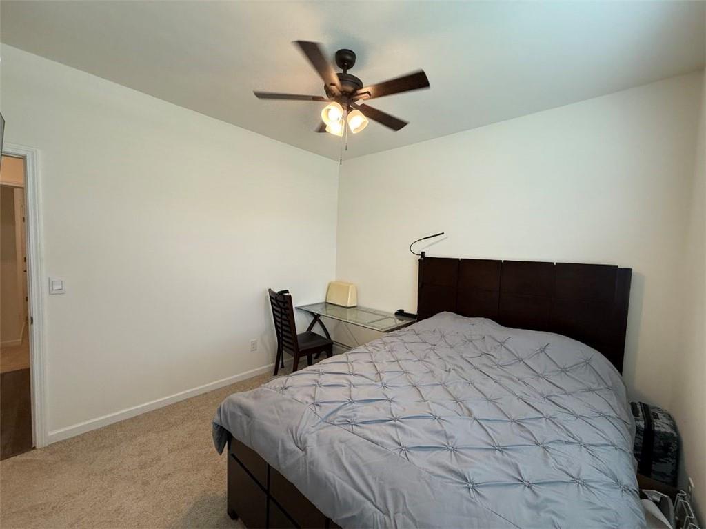 2015 Waycross Lane Dacula, GA 30019 - Photo 7 of 49 a bedroom with a bed and a table