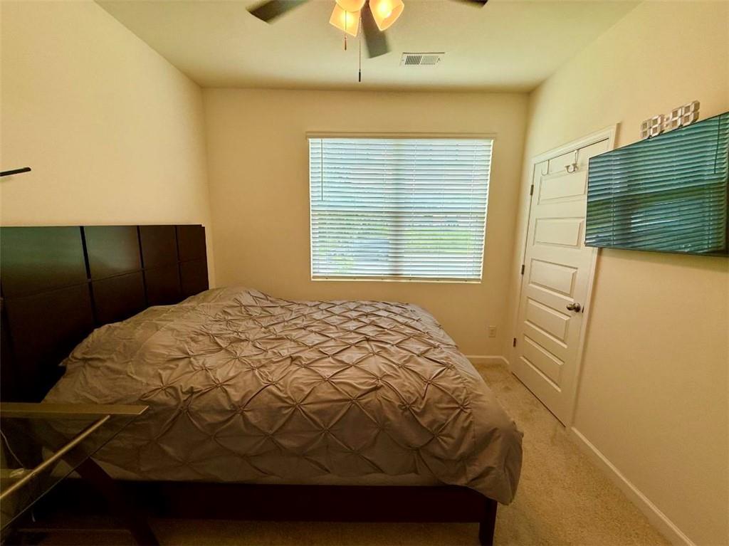 2015 Waycross Lane Dacula, GA 30019 - Photo 9 of 49 a bedroom with a bed and a window