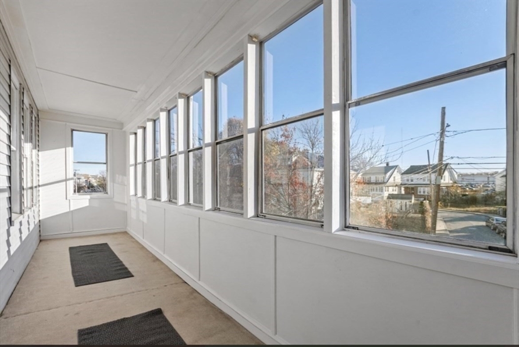 141 4th Street Medford, MA 02155 - Photo 7 of 26 a view of an entryway with a floor to ceiling window