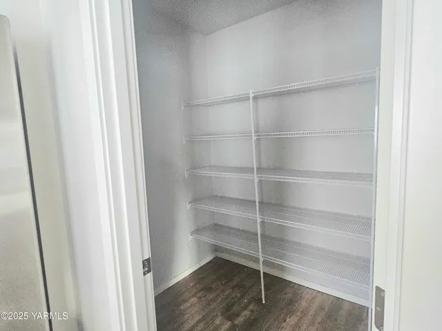 a storage room with wooden floor