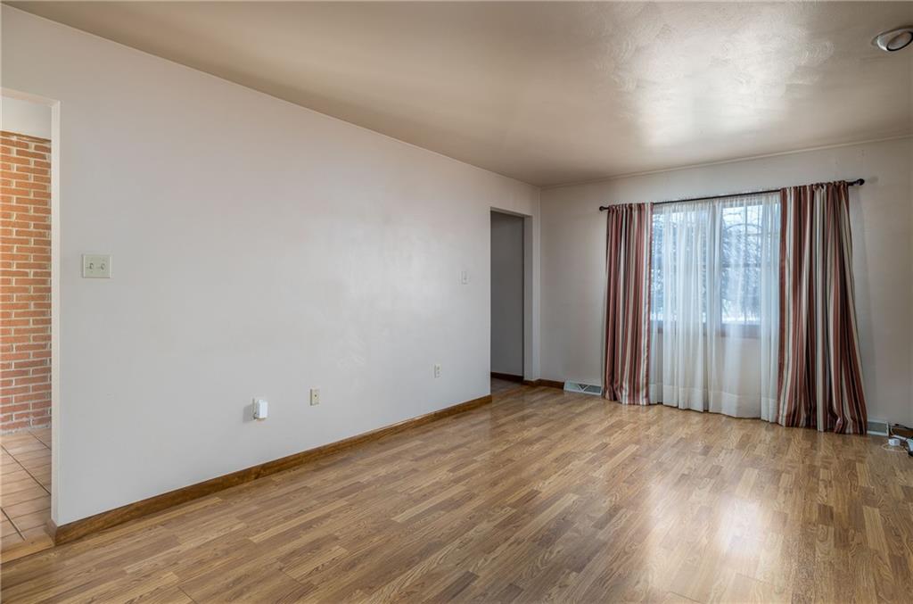 17 Cranberry Lane Cecil, PA 15321 - Photo 5 of 25 an empty room with wooden floor and windows