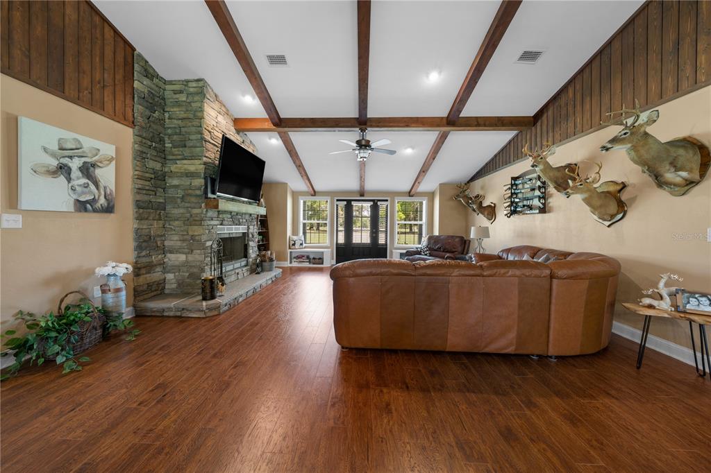 4639 Southwest Wilson Springs Road Fort White, FL 32038 - Photo 11 of 76 a living room with furniture and wooden floor