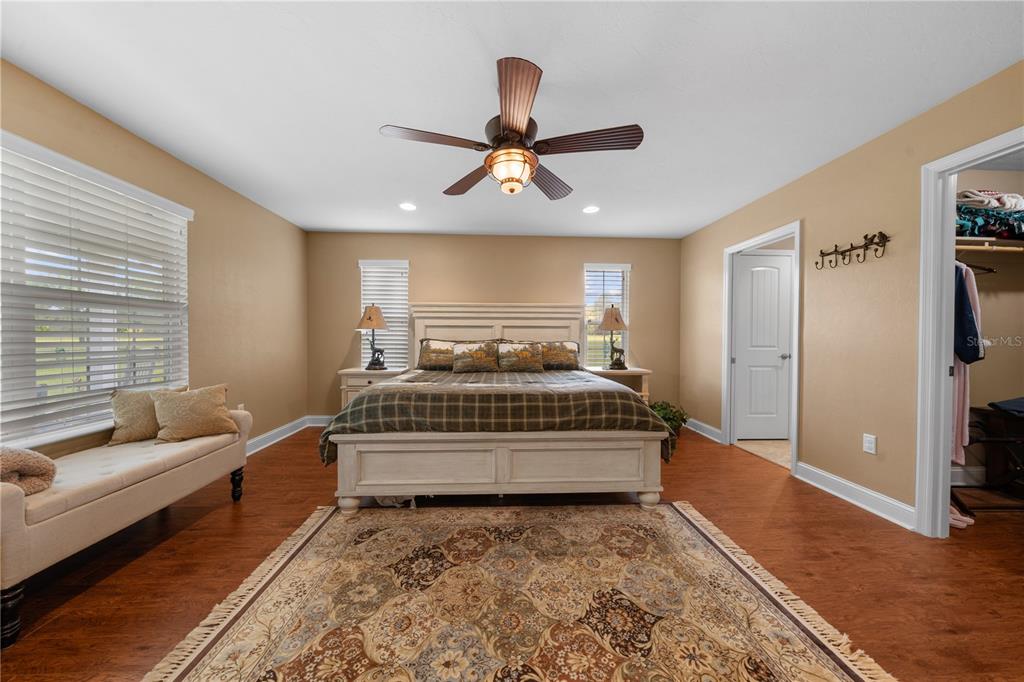 4639 Southwest Wilson Springs Road Fort White, FL 32038 - Photo 15 of 76 a bedroom with a bed and a couch