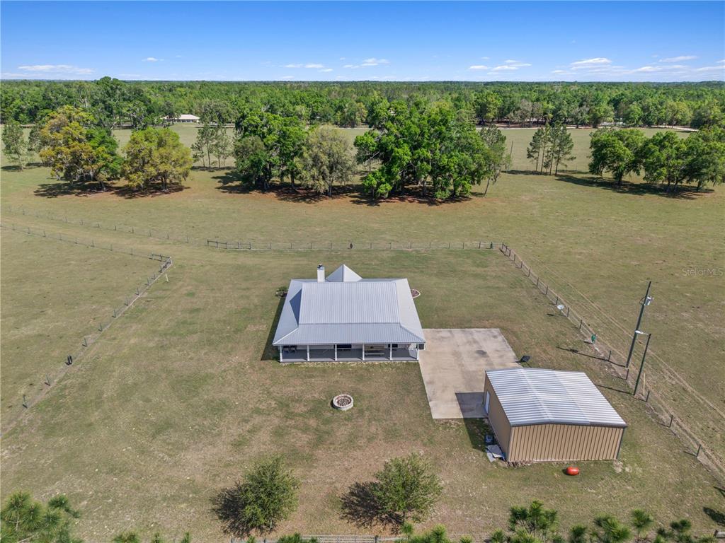 4639 Southwest Wilson Springs Road Fort White, FL 32038 - Photo 30 of 76 an aerial view of a house with a yard