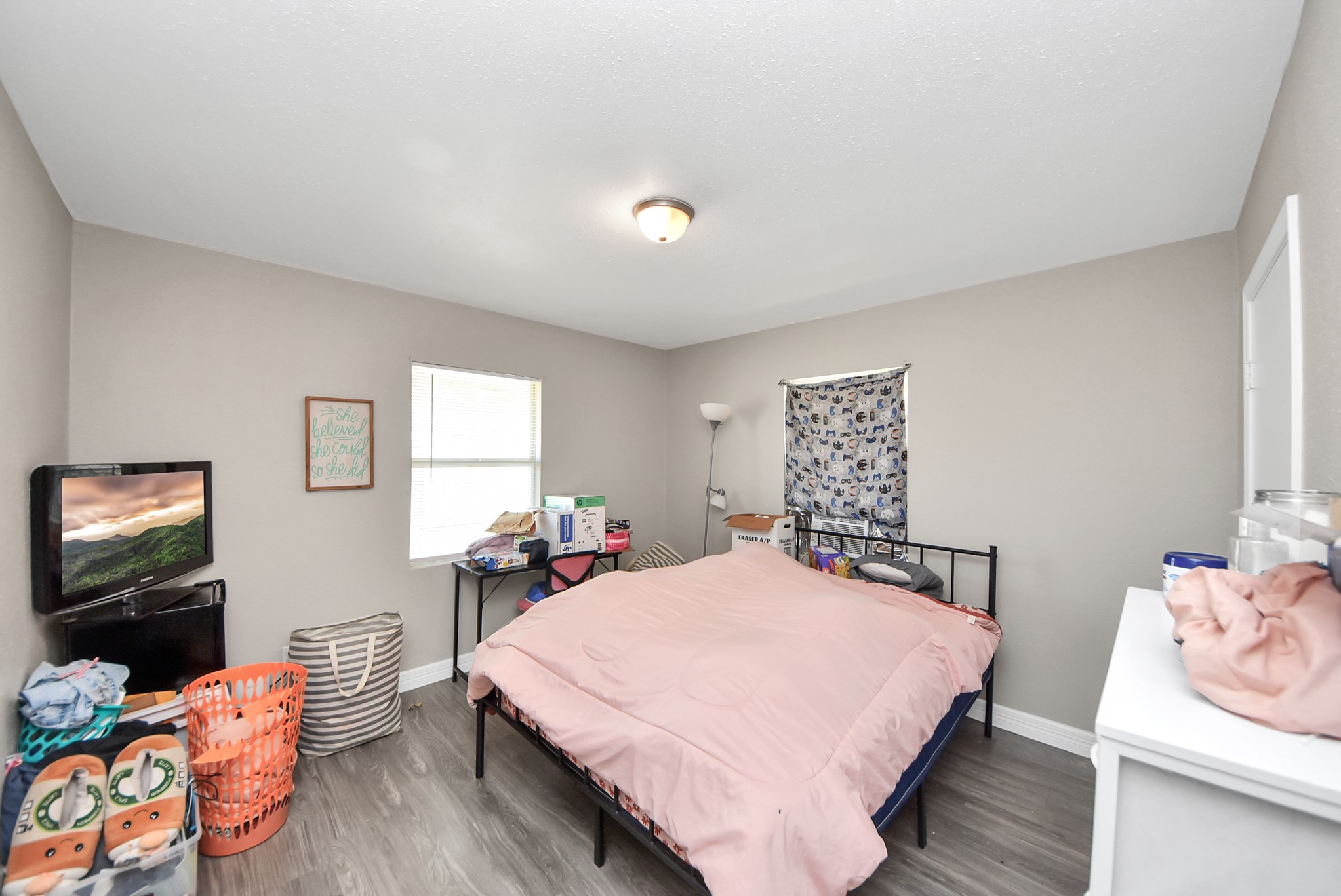 817 Church Street Crosby, TX 77532 - Photo 12 of 18 a bedroom with a bed and wooden floor