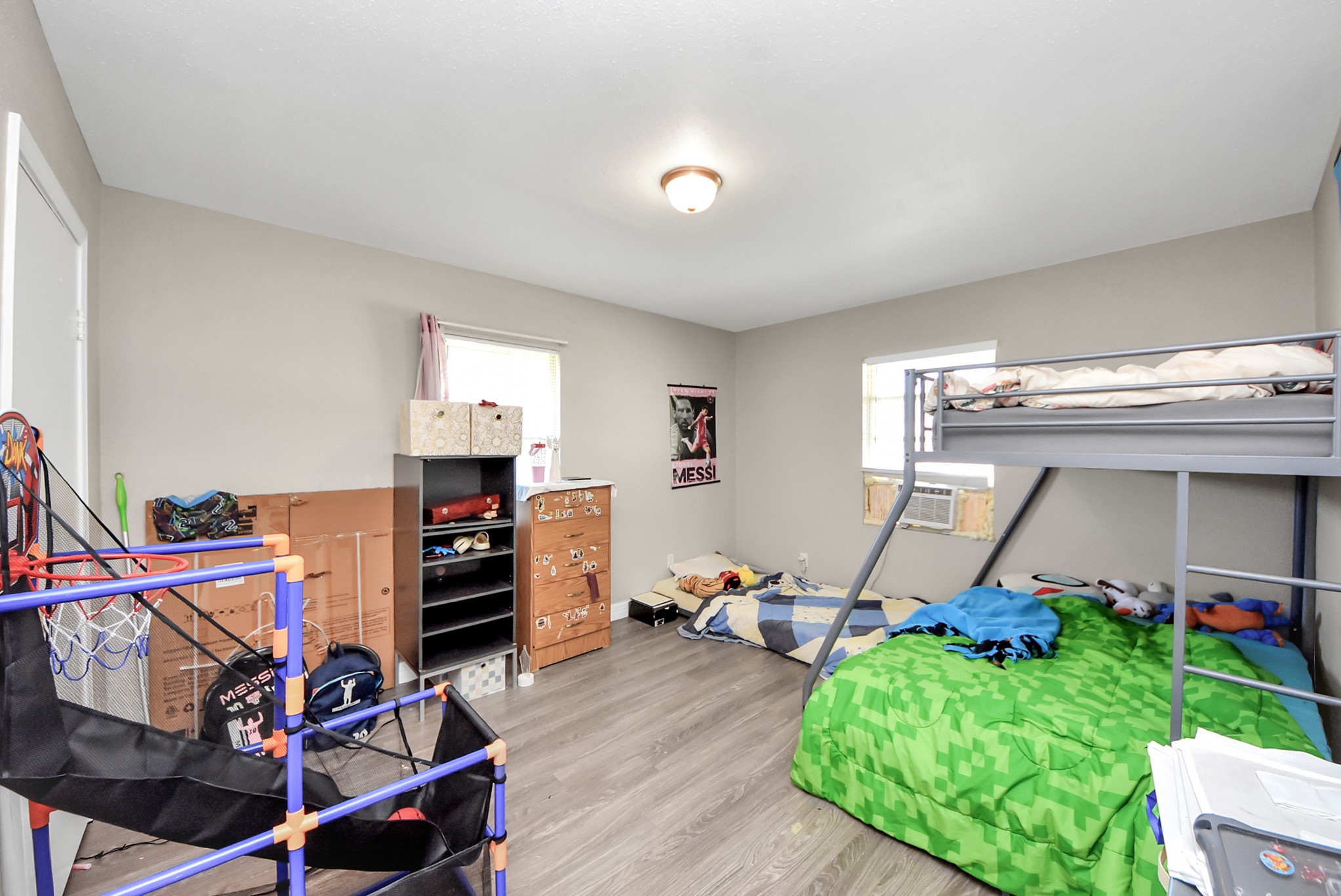 817 Church Street Crosby, TX 77532 - Photo 13 of 18 a bedroom with furniture and a wooden floor
