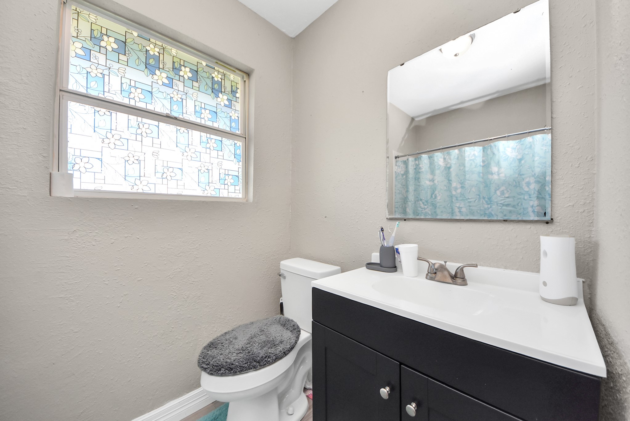 817 Church Street Crosby, TX 77532 - Photo 15 of 18 a bathroom with a sink a toilet and a window