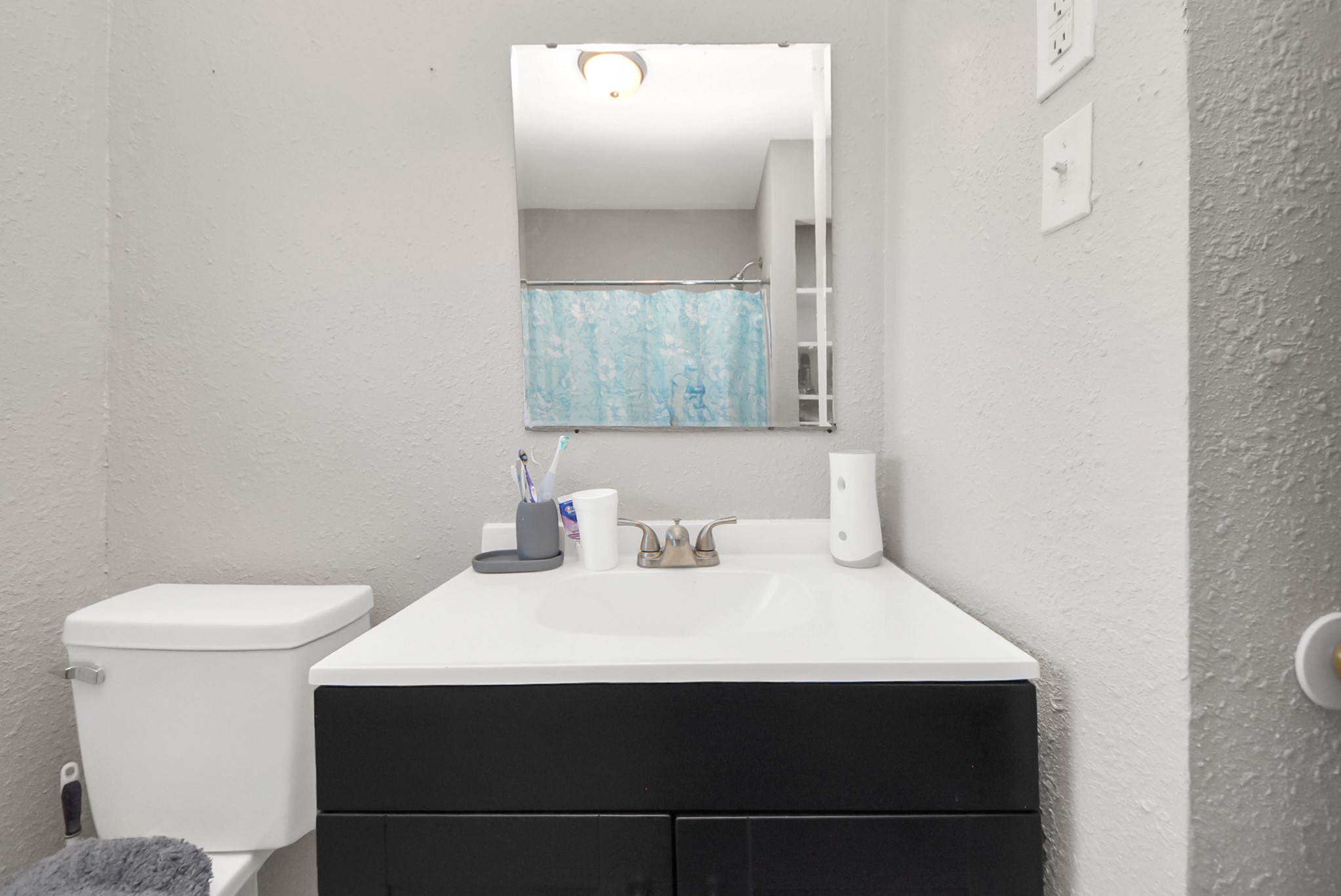 817 Church Street Crosby, TX 77532 - Photo 16 of 18 a bathroom with a sink vanity and toilet