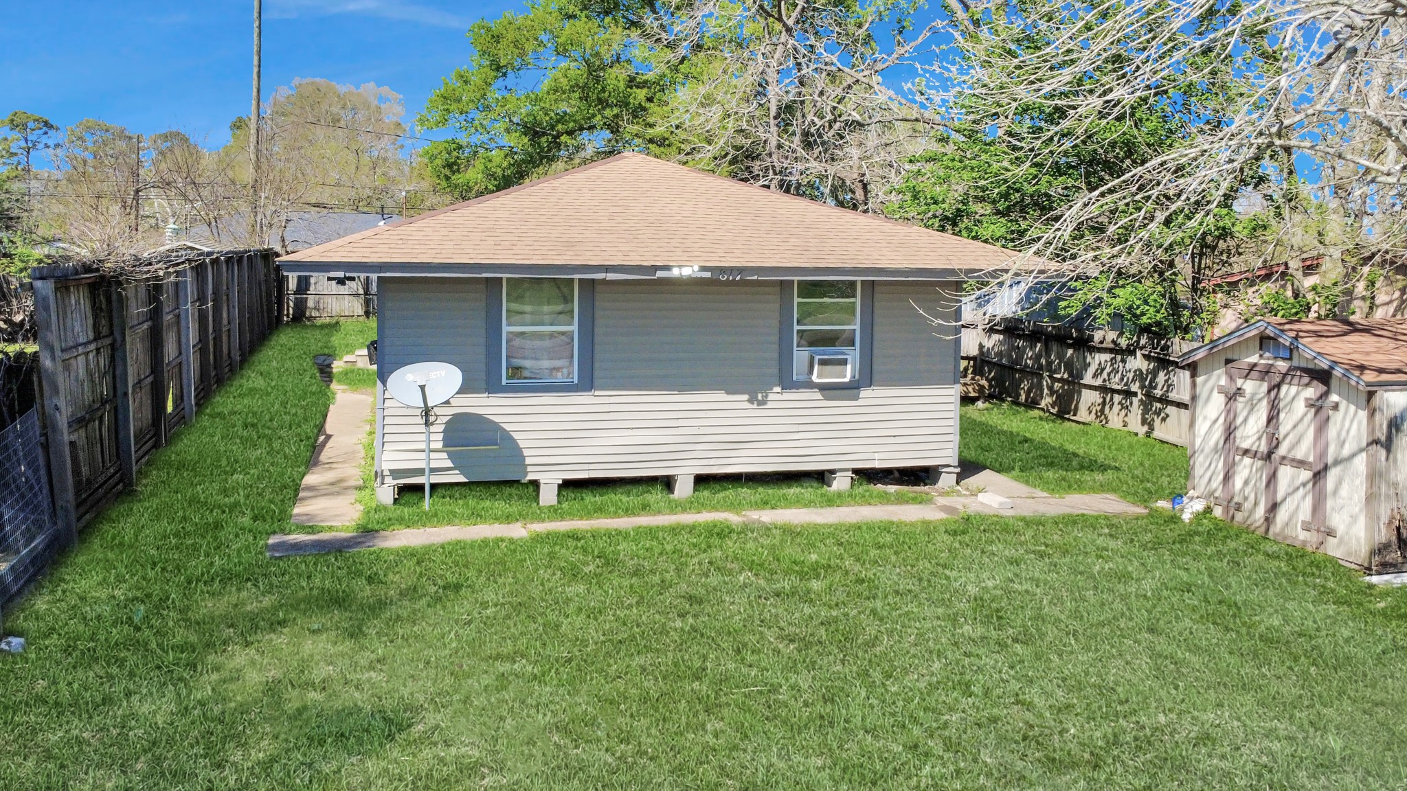 817 Church Street Crosby, TX 77532 - Photo 18 of 18 a backyard of a house with table and chairs