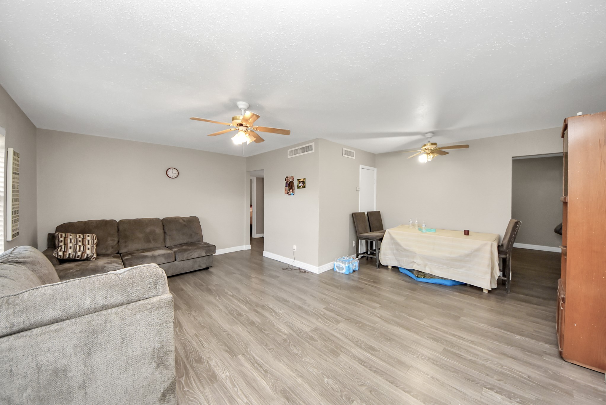 817 Church Street Crosby, TX 77532 - Photo 5 of 18 a living room with furniture and a chandelier