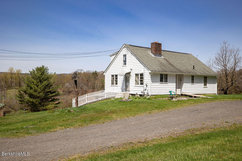 45 Swamp Road West Stockbridge, MA 01266 - Photo 15 of 52 a front view of a house with a yard