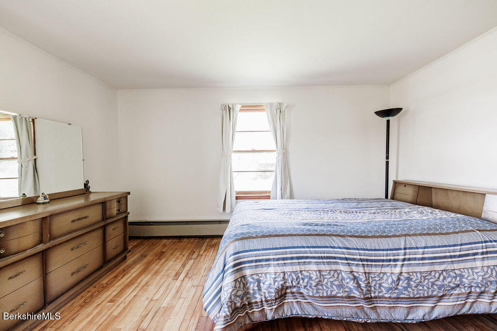 45 Swamp Road West Stockbridge, MA 01266 - Photo 28 of 52 a bed sitting in a bedroom next to a window