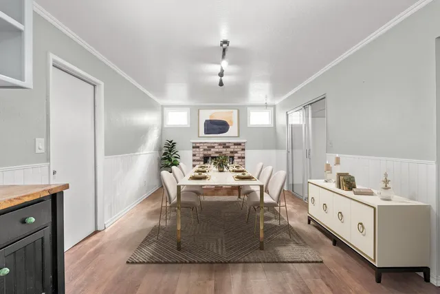 a large white kitchen with a large window