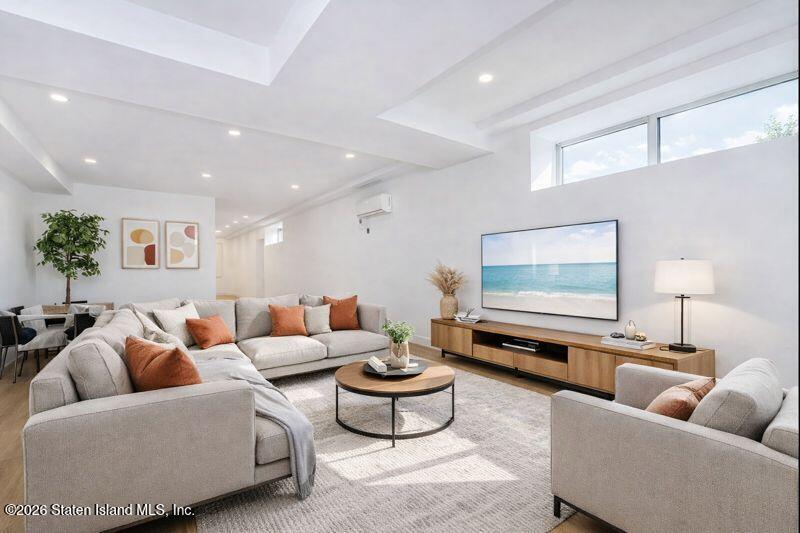 909 Rathbun Avenue Staten Island, NY 10309 - Photo 18 of 35 a living room with furniture and a flat screen tv