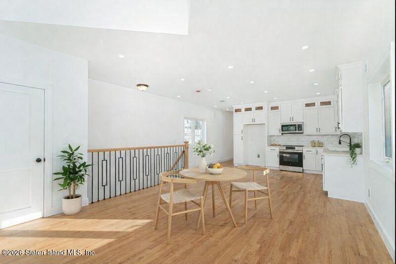 909 Rathbun Avenue Staten Island, NY 10309 - Photo 10 of 35 a view of a dining room with furniture