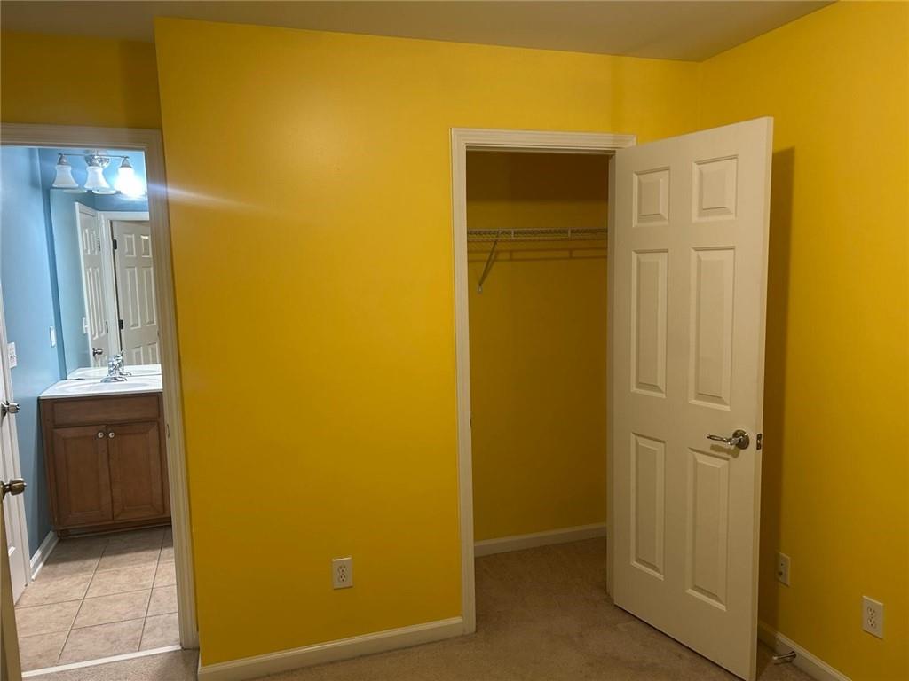 815 Earlham Drive Suwanee, GA 30024 - Photo 11 of 30 a view of a bathroom with a door