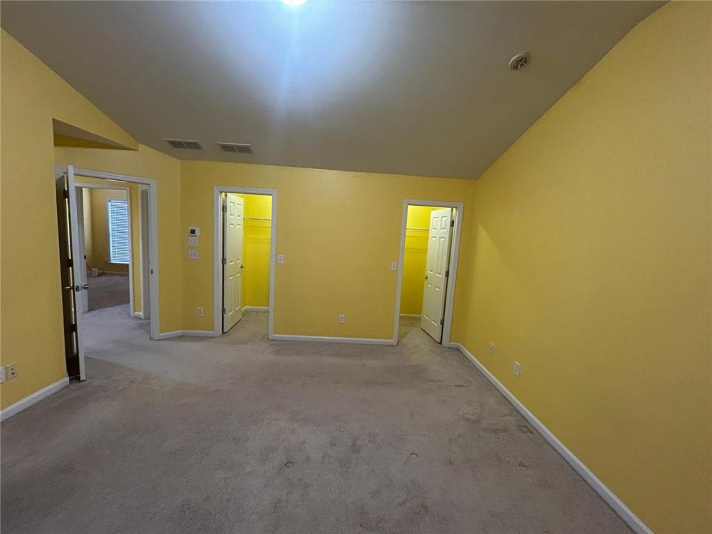 815 Earlham Drive Suwanee, GA 30024 - Photo 13 of 30 a view of an empty room with painted walls