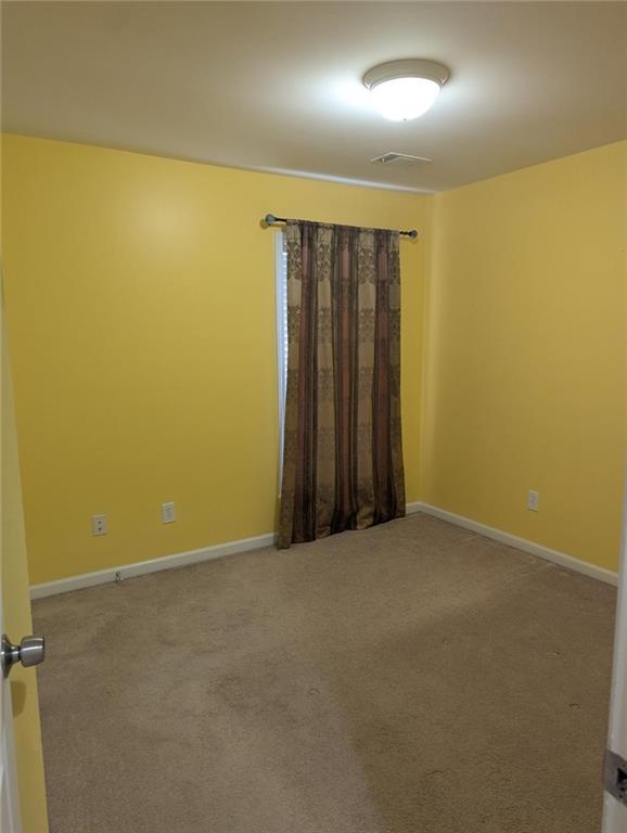 815 Earlham Drive Suwanee, GA 30024 - Photo 15 of 30 an empty room with a hallway