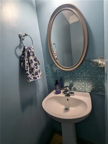 a bathroom with a sink and mirror