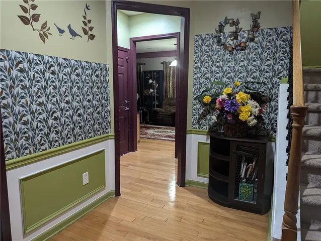 a view of a entryway door of the house and living room
