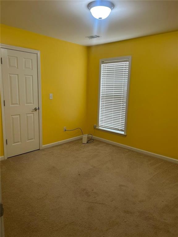 815 Earlham Drive Suwanee, GA 30024 - Photo 18 of 30 a view of an empty room with a window