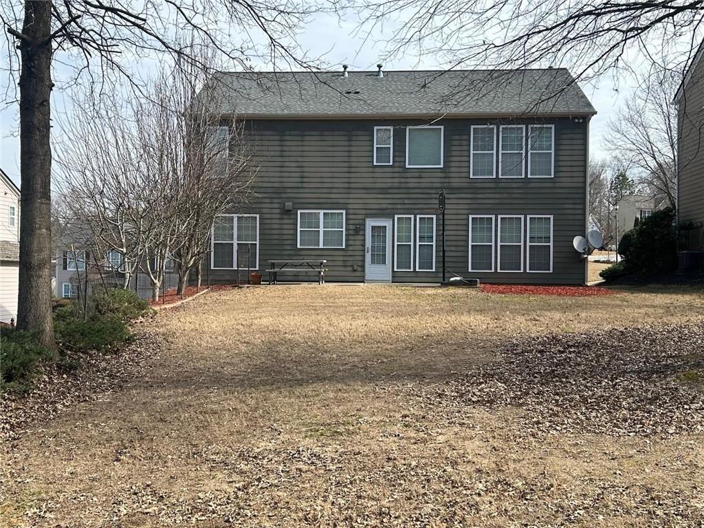 815 Earlham Drive Suwanee, GA 30024 - Photo 29 of 30 a front view of a house with a yard