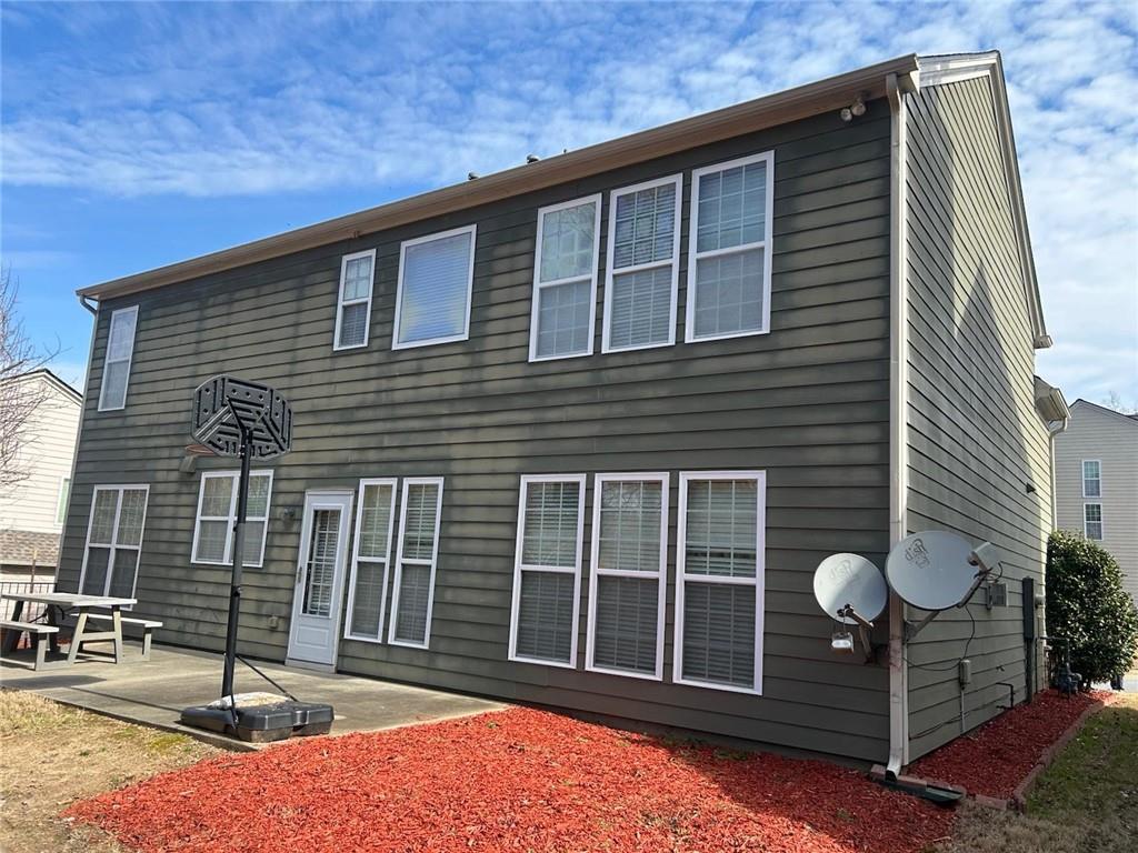 815 Earlham Drive Suwanee, GA 30024 - Photo 30 of 30 a front view of a house with glass windows