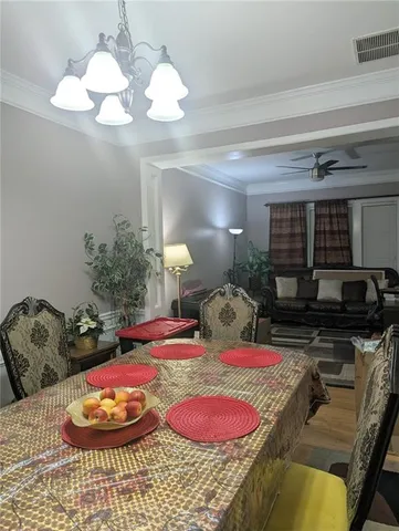 a bed room with furniture and a chandelier