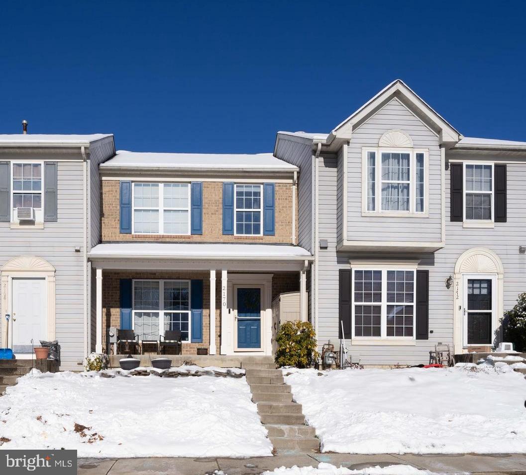 a front view of a building with sitting space