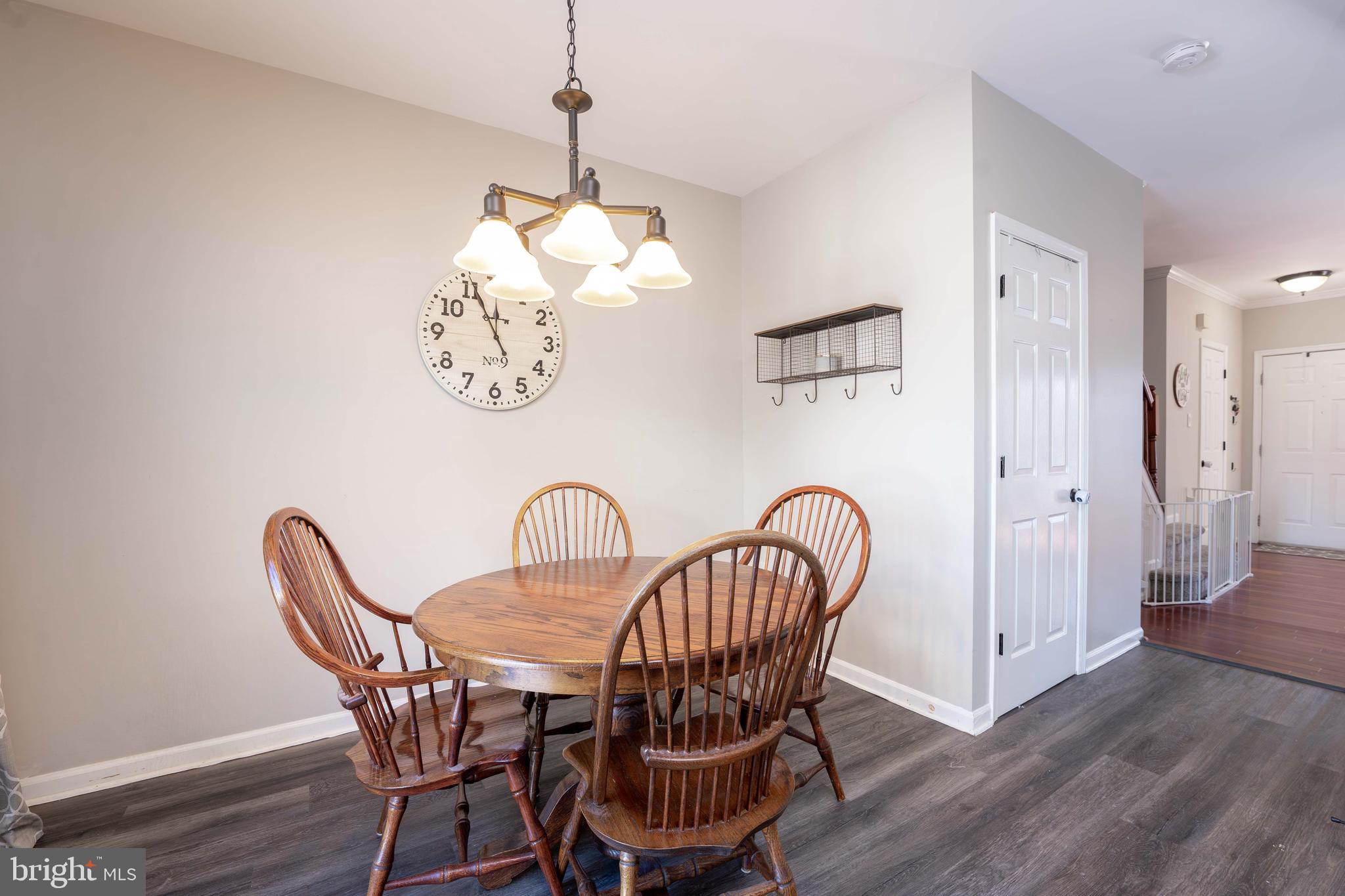 2170 Sewanee Drive Forest Hill, MD 21050 - Photo 13 of 34 a dining room with furniture wooden floor a chandelier