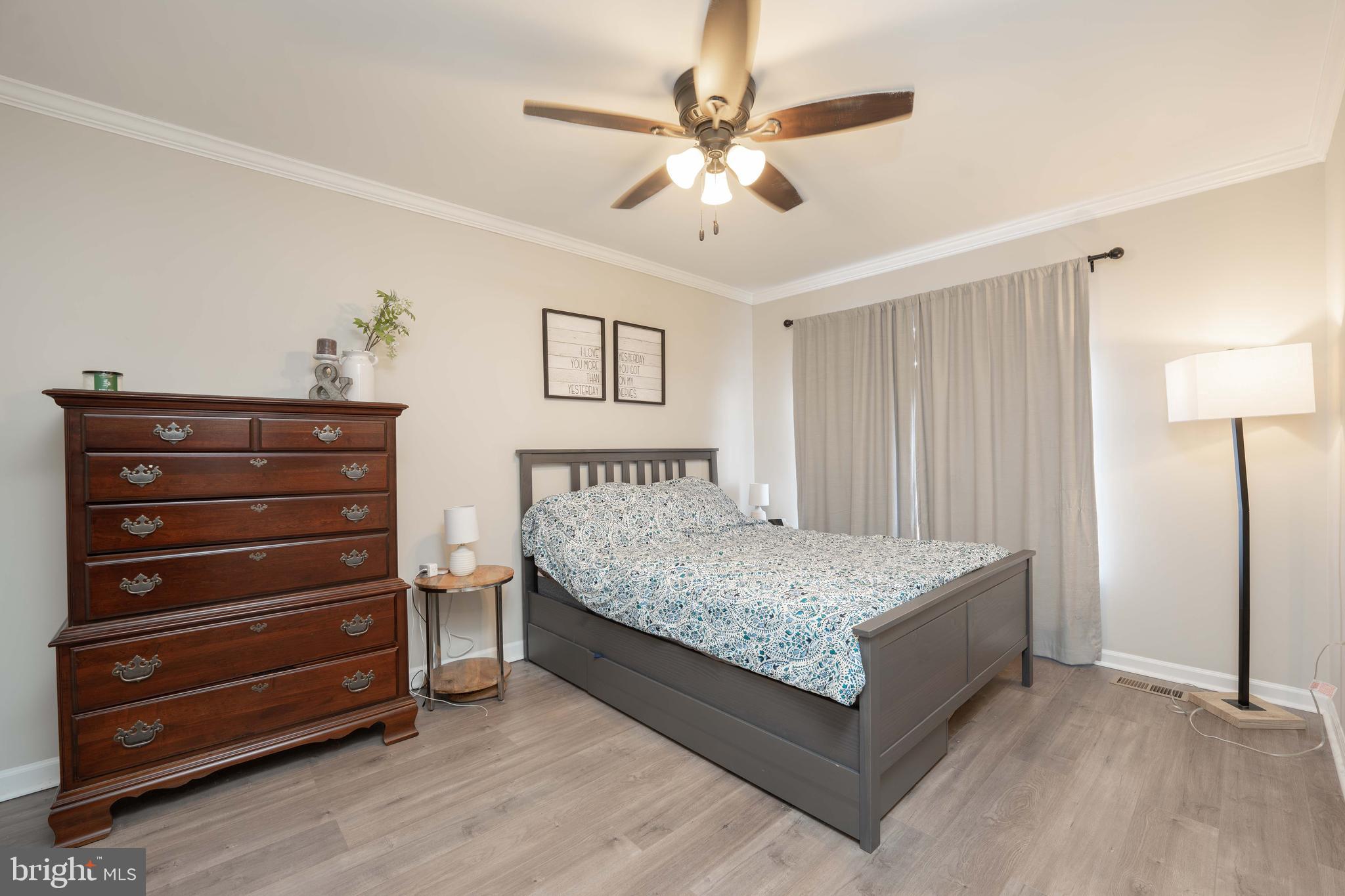 2170 Sewanee Drive Forest Hill, MD 21050 - Photo 21 of 34 a spacious bedroom with a bed and a chandelier