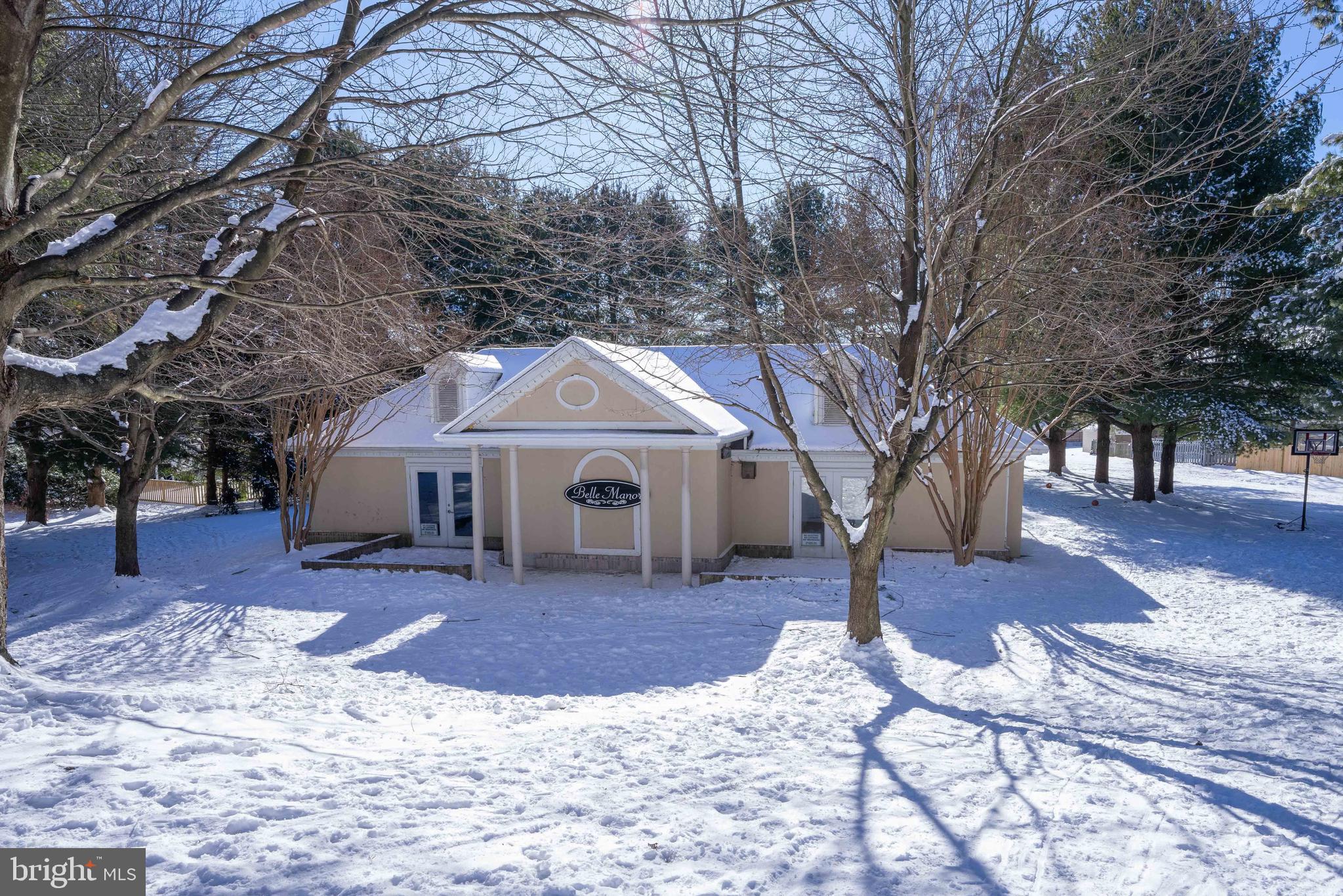 2170 Sewanee Drive Forest Hill, MD 21050 - Photo 33 of 34 a front view of a house with a yard covered in snow