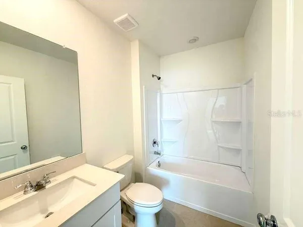 an empty room with a windows