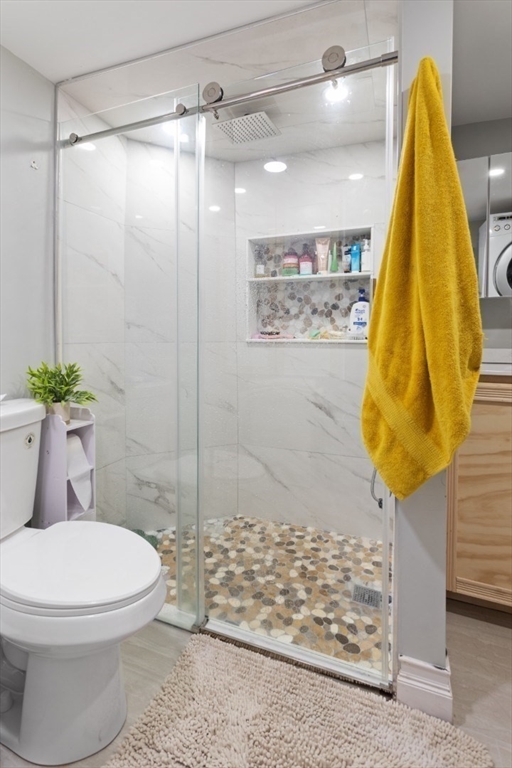 14 Bay Road Revere, MA 02151 - Photo 11 of 38 a bathroom with a toilet and shower