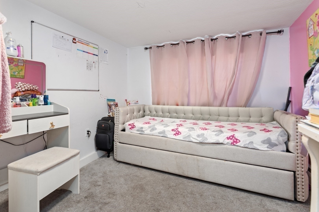 14 Bay Road Revere, MA 02151 - Photo 13 of 38 a bedroom with a bed and a couch