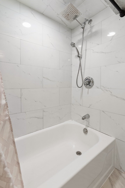 14 Bay Road Revere, MA 02151 - Photo 18 of 38 a bathroom with a bath tub with a shower