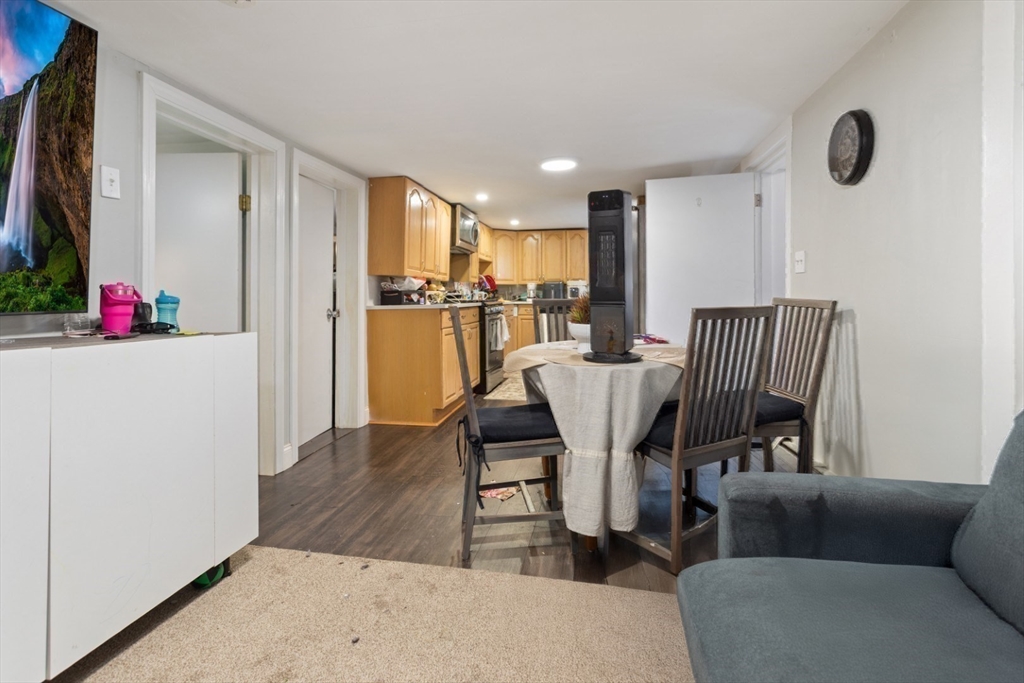 14 Bay Road Revere, MA 02151 - Photo 23 of 38 a living room with furniture and a flat screen tv
