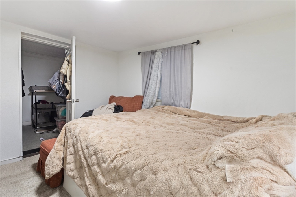 14 Bay Road Revere, MA 02151 - Photo 29 of 38 a bedroom with a bed and a closet