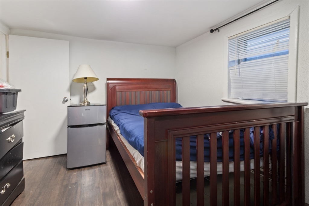 14 Bay Road Revere, MA 02151 - Photo 31 of 38 a kitchen with granite countertop a stove and a refrigerator