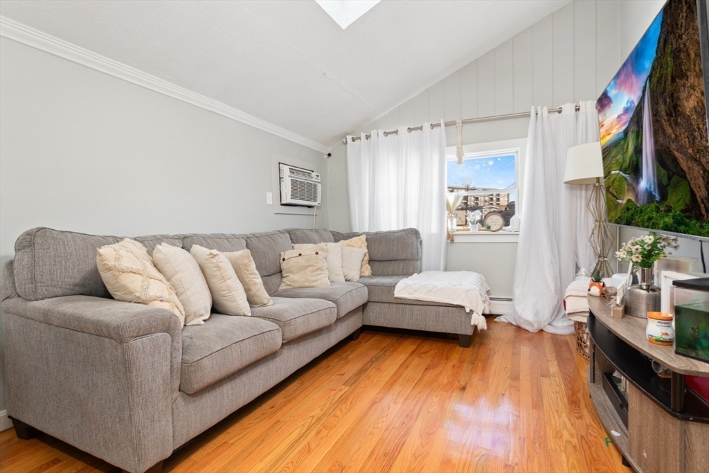 14 Bay Road Revere, MA 02151 - Photo 5 of 38 a living room with furniture and a flat screen tv
