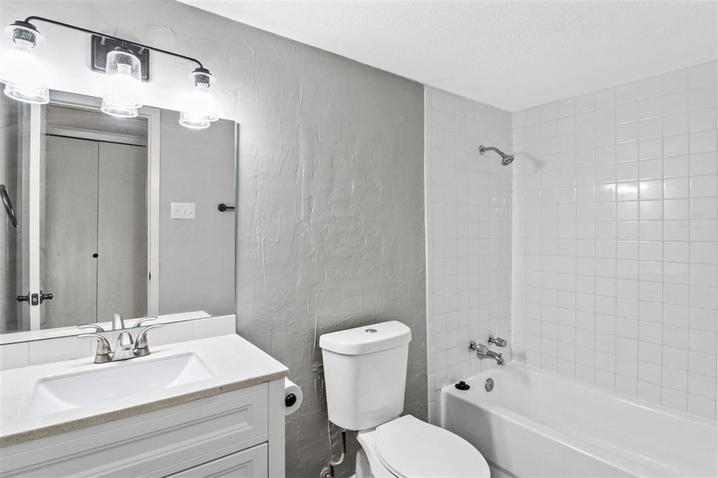 519 Windsor Drive Allen, TX 75002 - Photo 11 of 11 a bathroom with a sink a toilet and shower