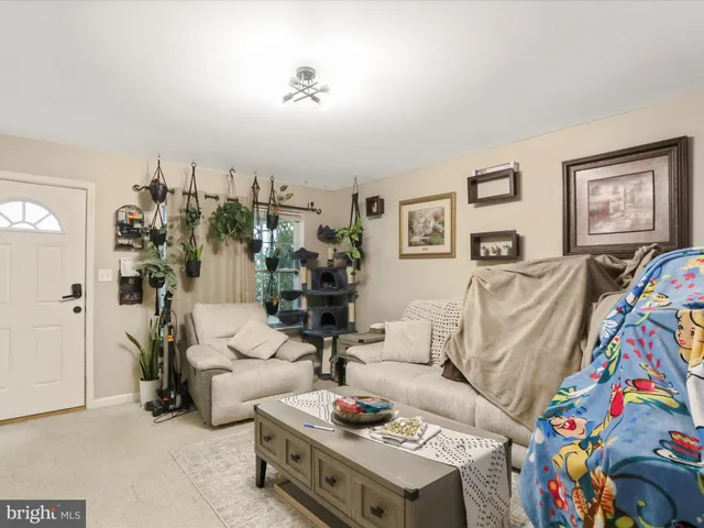 a living room with furniture and a table