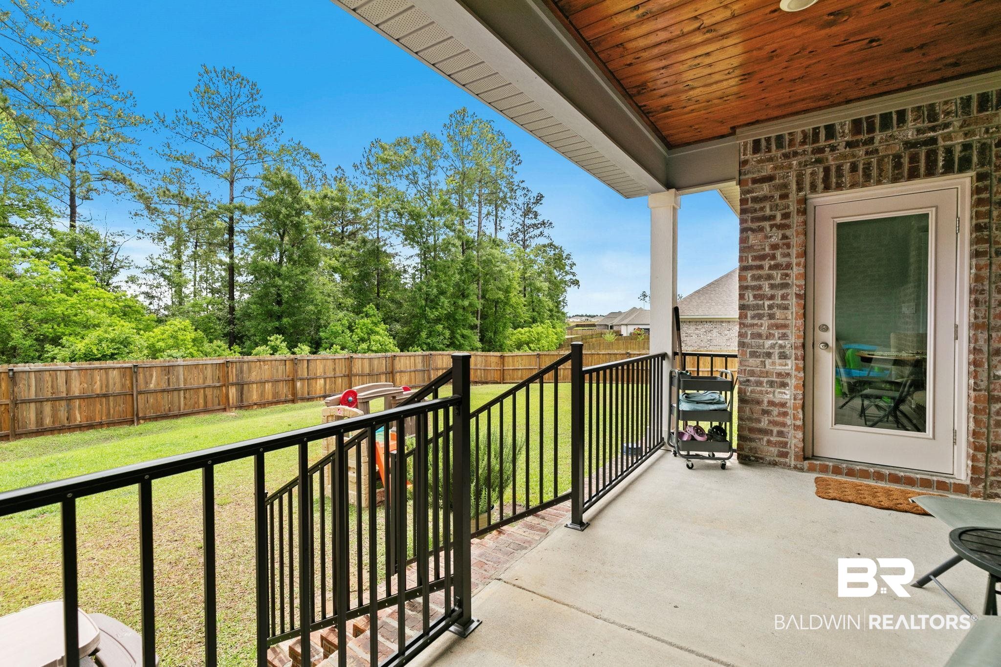 13233 Ibis Boulevard Daphne, AL 36527 - Photo 53 of 100 Covered patio with a wood-finish ceiling and brick exterior