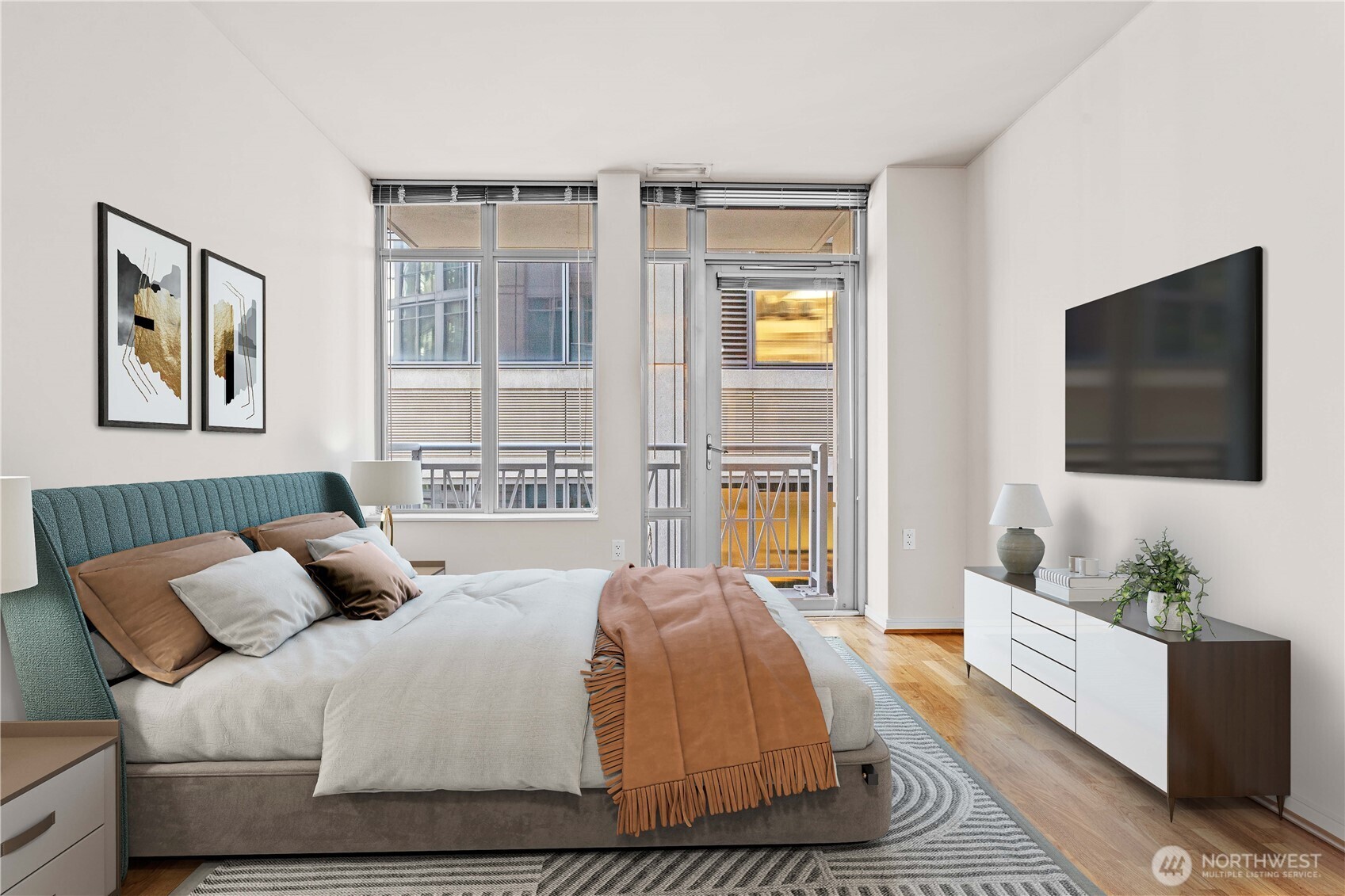 819 Virginia Street, Unit 1408 Seattle, WA 98101 - Photo 11 of 39 a bedroom with a bed and a flat screen tv