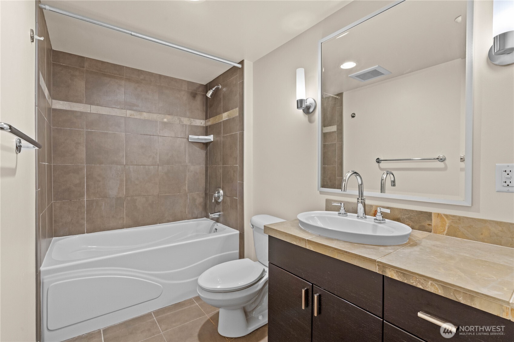 819 Virginia Street, Unit 1408 Seattle, WA 98101 - Photo 15 of 39 a bathroom with a sink a toilet and a bathtub