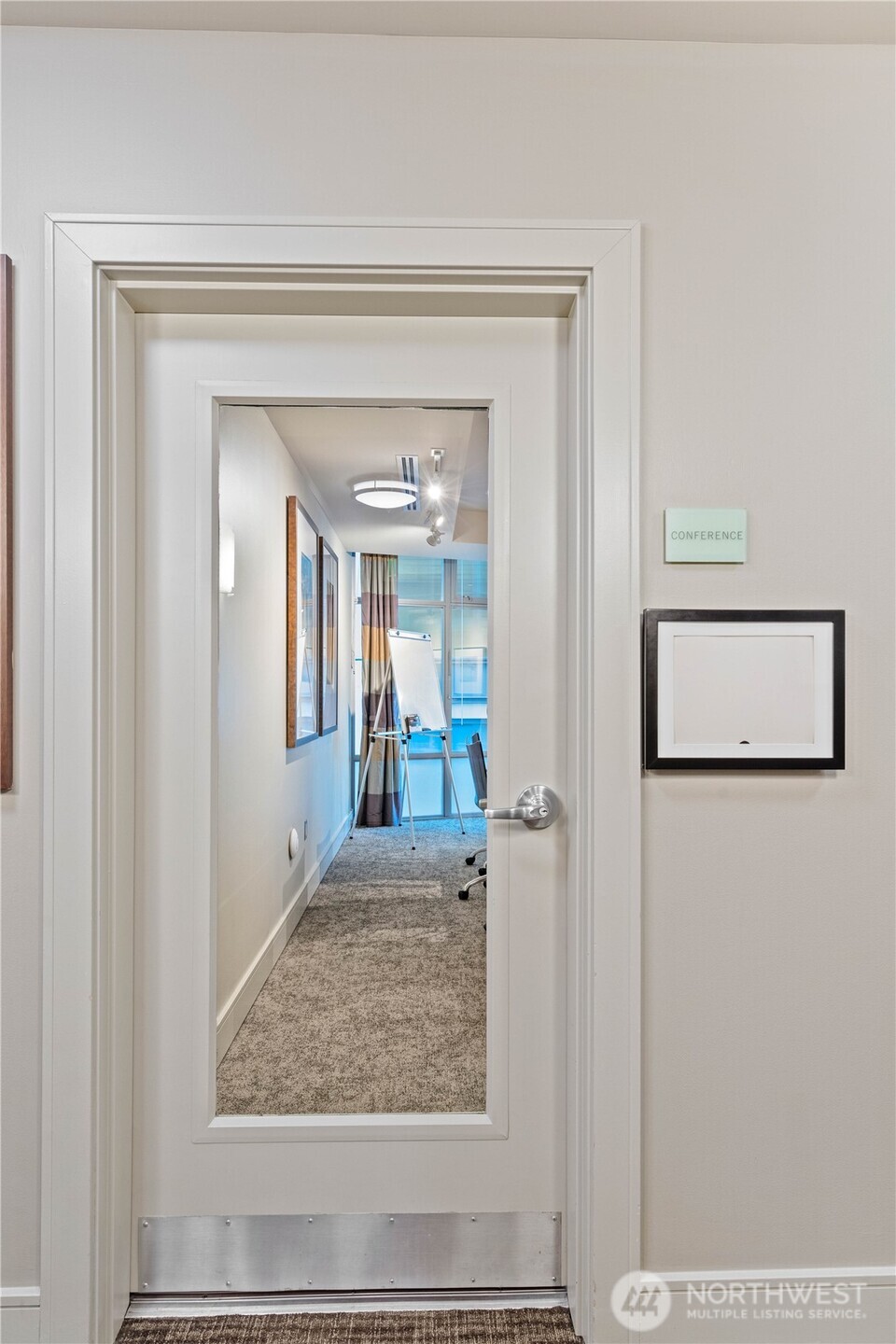 819 Virginia Street, Unit 1408 Seattle, WA 98101 - Photo 28 of 39 a view of a hallway view of a hallway with wooden floor and a living room