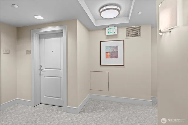 a living room with furniture a flat screen tv and a floor to ceiling window