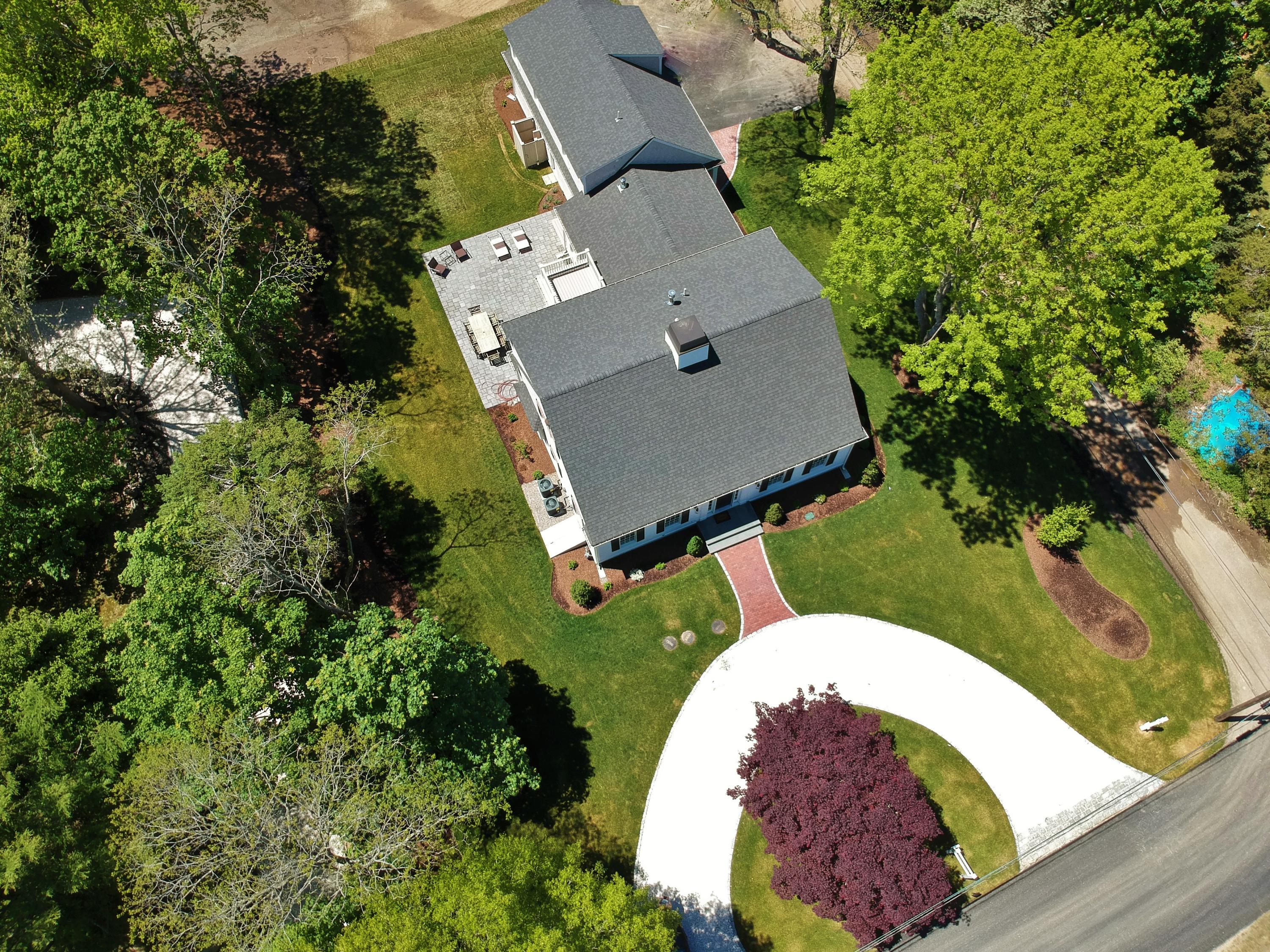 101 Gibson Road Orleans, MA 02653 - Photo 2 of 65 an aerial view of a house with a swimming pool and outdoor seating