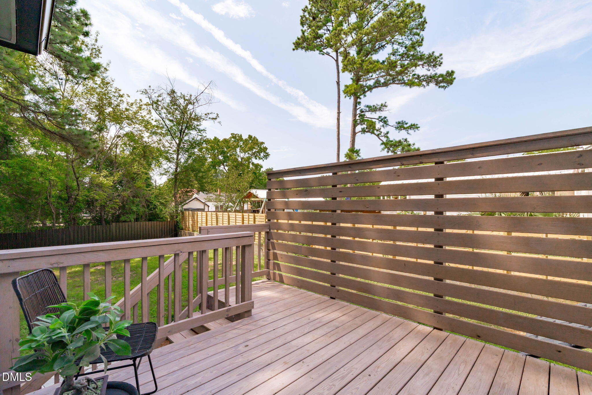 728 Brighton Road Raleigh, NC 27610 - Photo 12 of 38 Privacy screen, new decking, and painted exterior for enjoying the wooded views.
